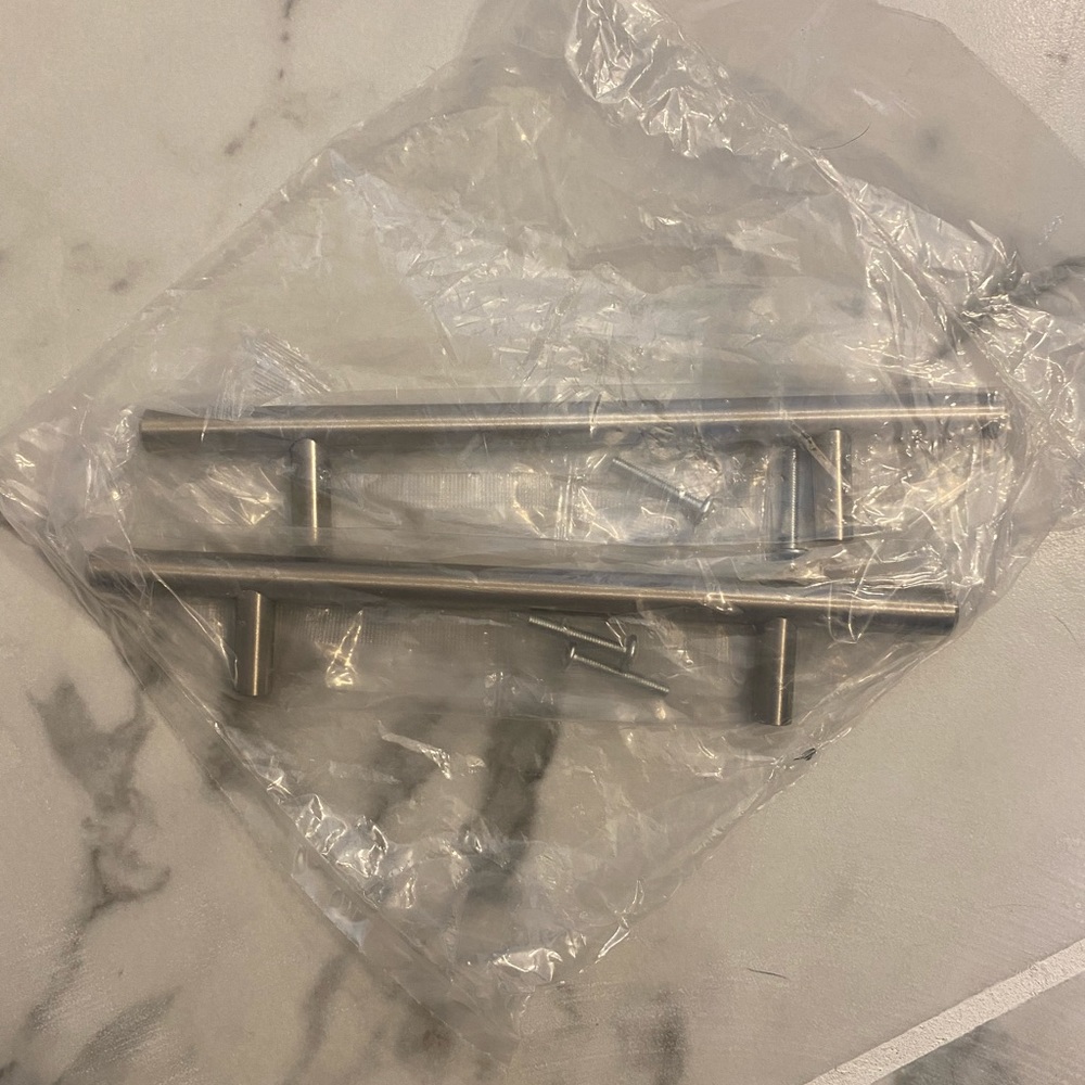 Chrome cabinet pulls/handles (2) 5 in (screw holes) 8.25 total length of handle